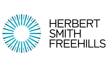 Herbert Smith Freehills logo featuring a circular teal sunburst design on the left and the company name in black capital letters stacked vertically on the right.