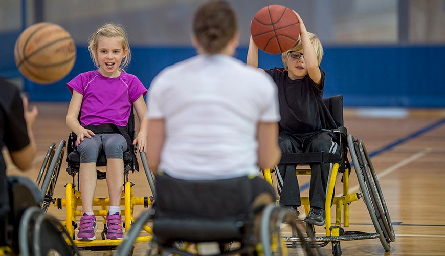 children playing wheelchair basketball