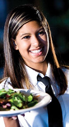 Image of a female hospitality worker