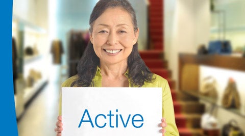 older woman with a sign "Active"