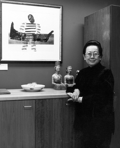 Professor Alice Tat, AM, FASSA - President, Human Rights and Equal Opportunity Commission . Pictured with Sidney Nolan's 'Convict', 1967, from  the Artbank  Collection.  Photographed by Martin van der Wal.  Artbank 2001, Reproduced with kind permission of Artbank.