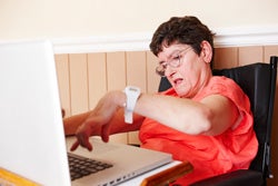 Woman with disability on computer