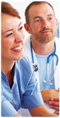 A male doctor with a lady smiling