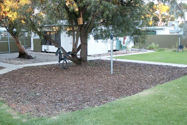 View of communal garden and an accommodation unit at the Woomera Residential Housing Project, June 2002.