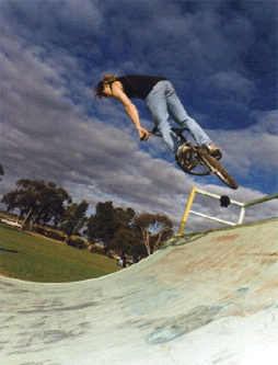 A young person enjoying the completed skate ramp.