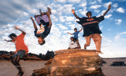 Image: Saltwater kids meet Desert Kids. Yough people enjoying what they have learnt from the Desert Acrobats at Ridell Beach, Broome. Photo by Michael Hutchinson