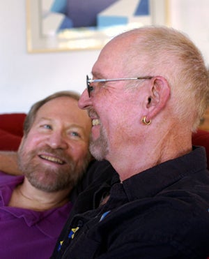 mature gay male couple smiling
