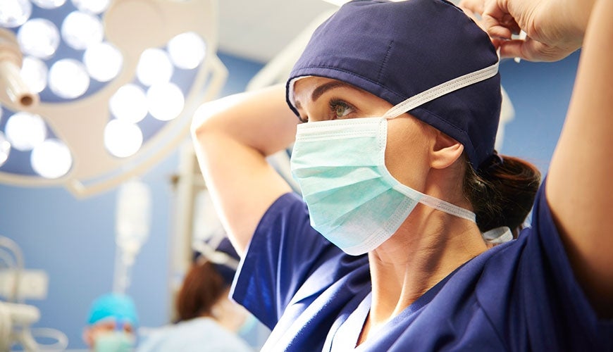 Doctor wearing mask in operating theatre