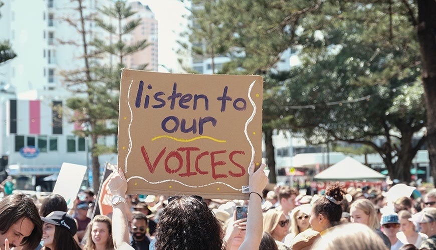 protest of young people with sign 'Listen to our voices'