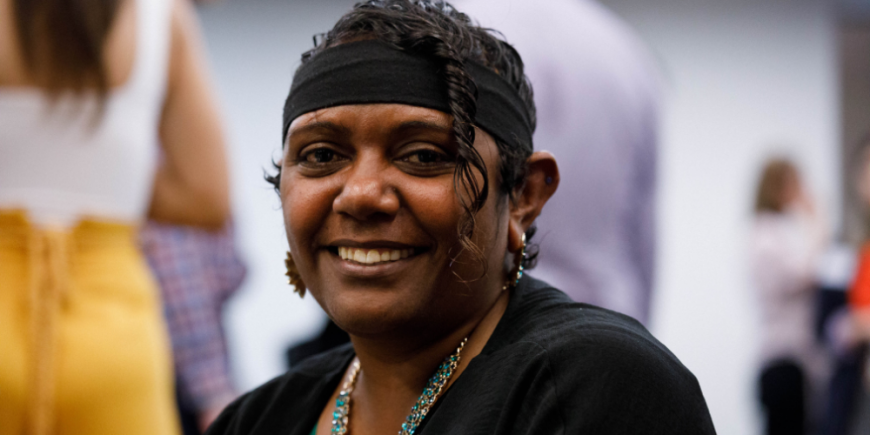 Jasmine Cavanagh at the Human Rights Awards in 2019 wearing a black headband, colourful necklace and black shawl 