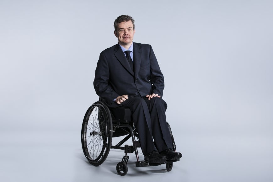 Portrait of Ben Gauntlett, who uses a wheelchair.