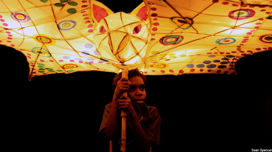 Photo of Aboriginal boy with bat lantern. Nimbois Bat by Sean Spencer.