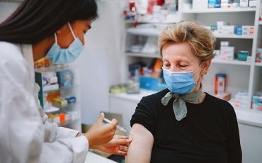Nurse giving COVID vaccination