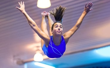 gymnast leaping through the air