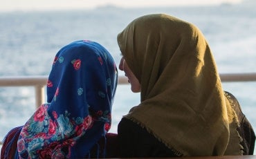 Two muslim women talking