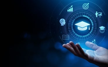 Digital education symbols float above an open hand