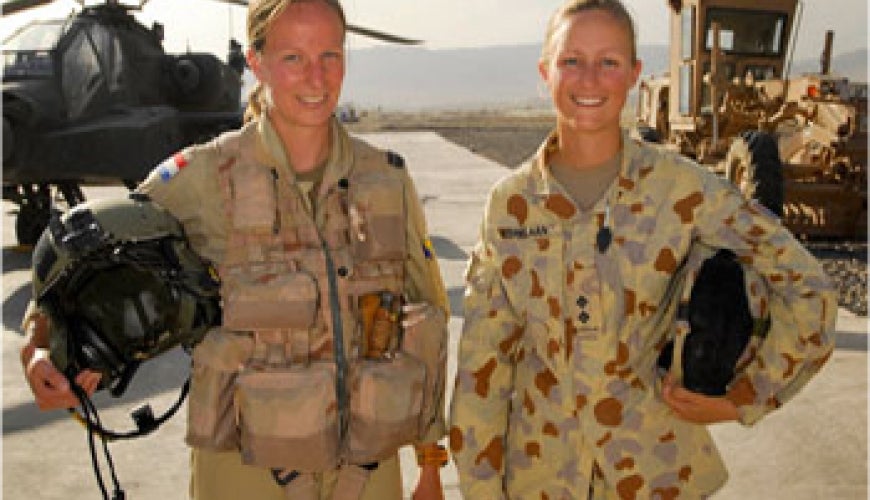 Women soldiers with helicopter. Image (c) Defence