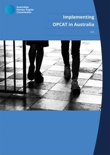Cover of Implementing OPCAT - two people walking through barred gate