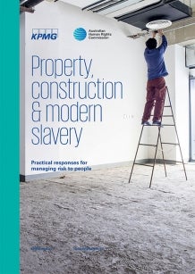 Man on tall ladder fitting light - Property Construction & Modern Slavery Cover