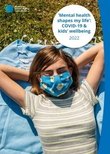 Report cover - girl wearing a mask laying outside on the grass in the sun
