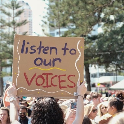 protest of young people with sign 'Listen to our voices'