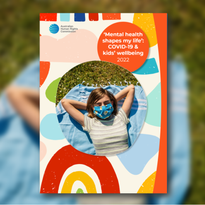 Report cover - girl wearing a mask laying outside on the grass in the sun
