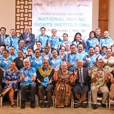 A large group of people, representing nations across the Pacific, stand and pose for the camera at the Pacific Regional Forum.