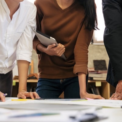 Diverse group of business people meeting in modern office