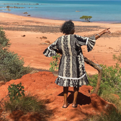 First Nations woman looks out to sea