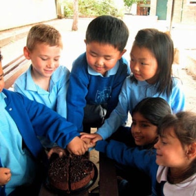 Photo: Cooperation by Amanda Lim - school children sharing a cake